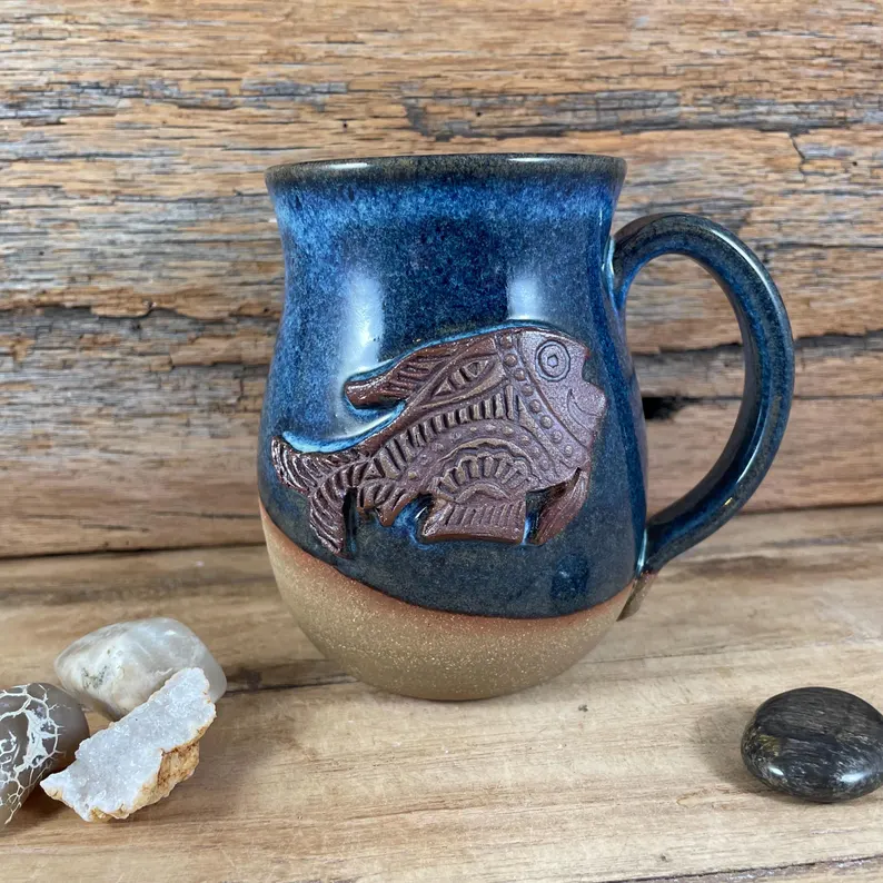 Blue ceramic mug with custom fish medallion